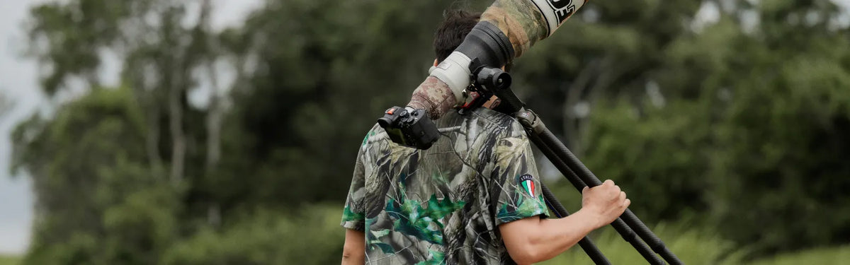 professional camera setup with tripod and telephoto lens for wildlife photography